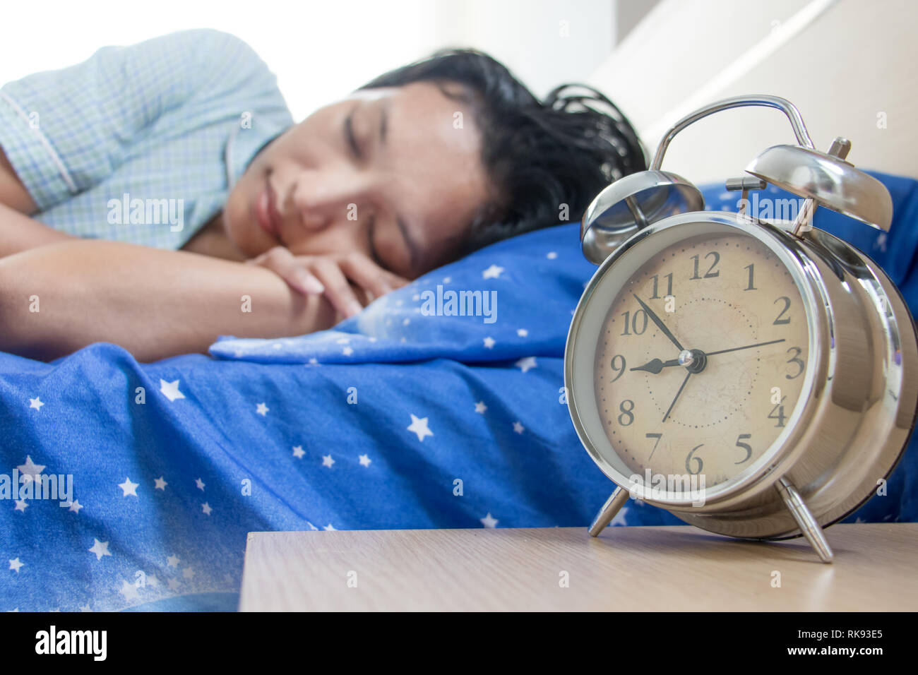 Young woman sleeping in nightgown. The girl is sleeping in bed with an