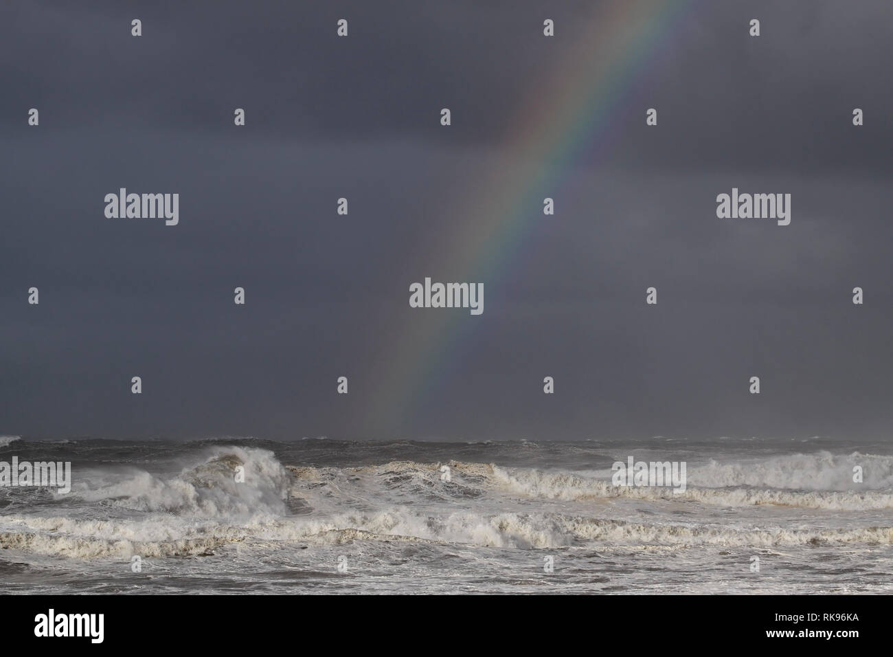 Rainbow against a dark sky hi-res stock photography and images - Alamy