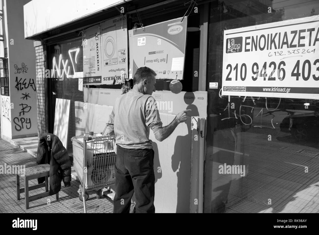 Shave in the street, Athens Greece Stock Photo