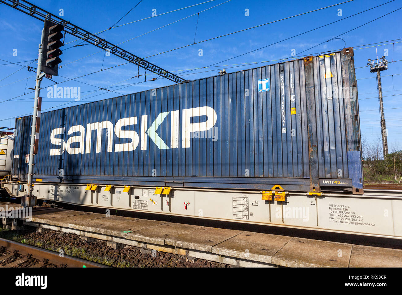 Shipping container Samskip transported by rail Stock Photo