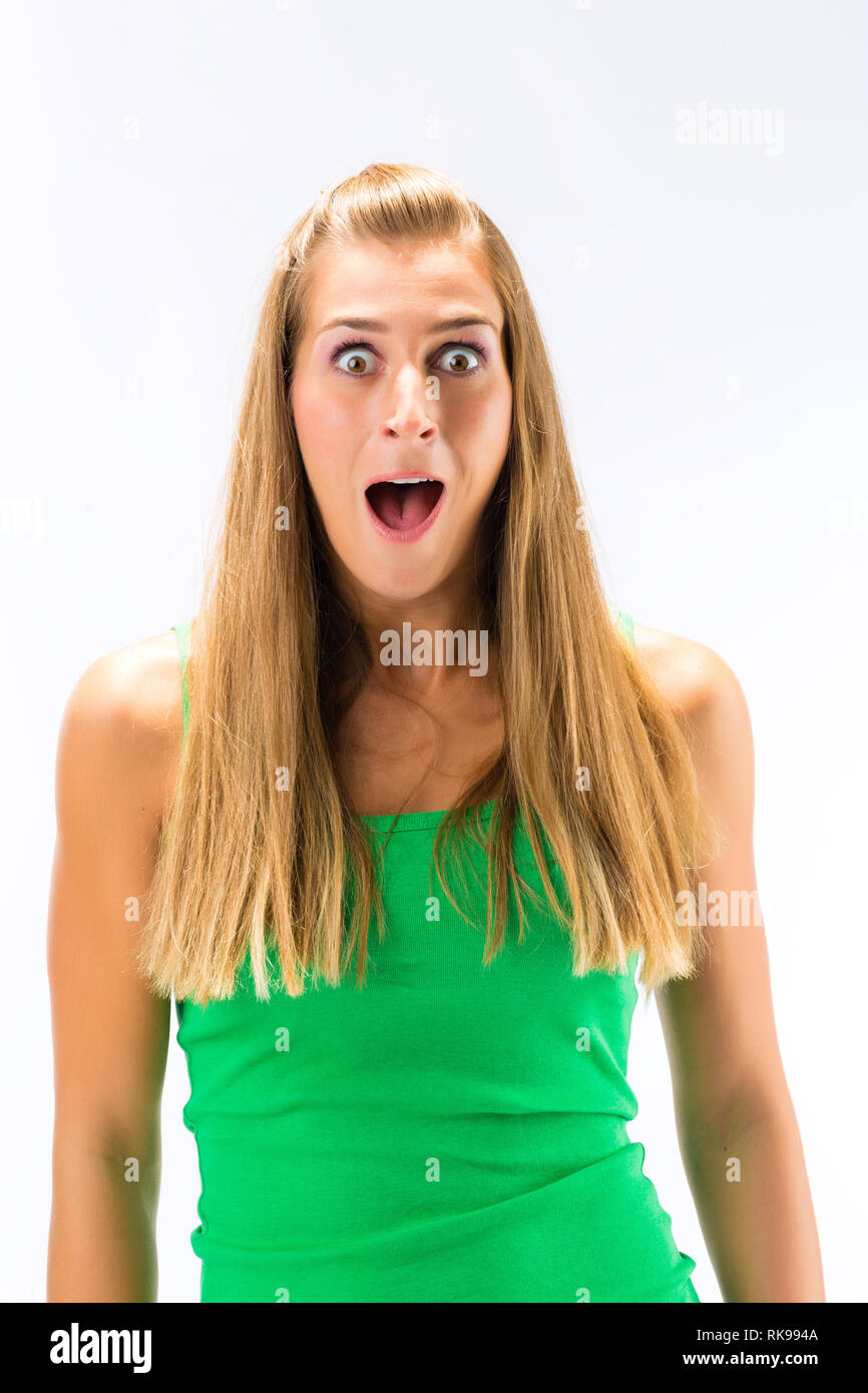 Surprised emotional young woman hi-res stock photography and images - Alamy