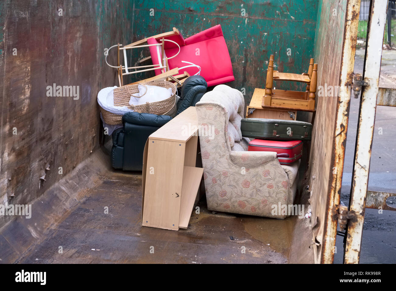 Old Furniture And Chairs Rubbish In Steel Container For Charity