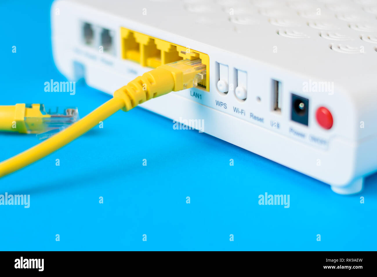 internet modem router hub with cable connecting on blue background Stock  Photo - Alamy