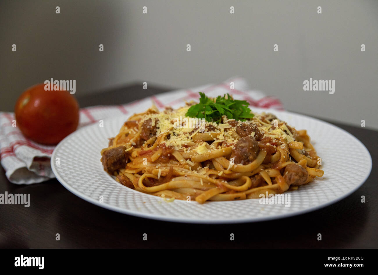 Spaghetti with oriental sausages Stock Photo