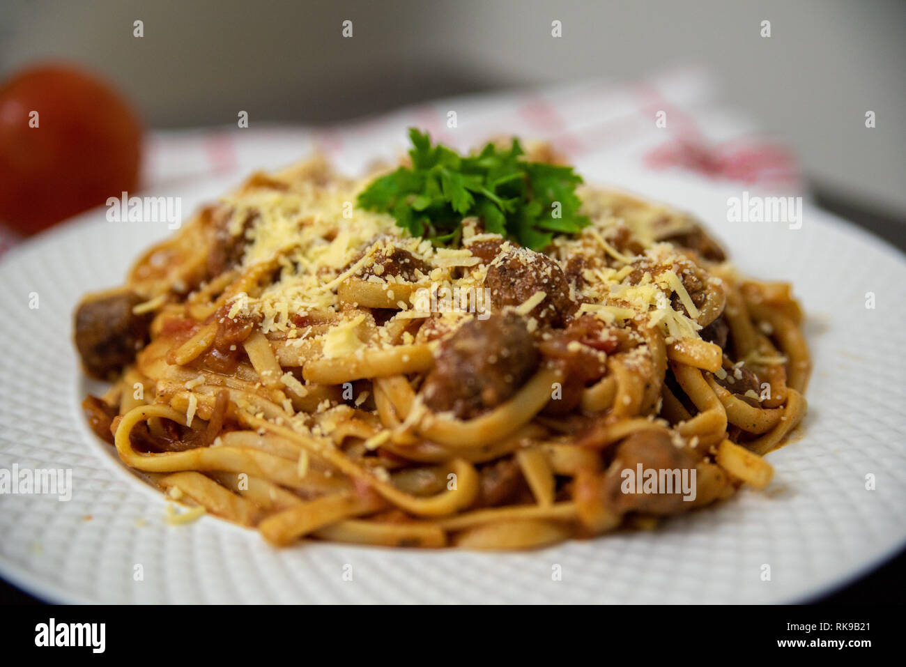 Spaghetti with oriental sausages Stock Photo