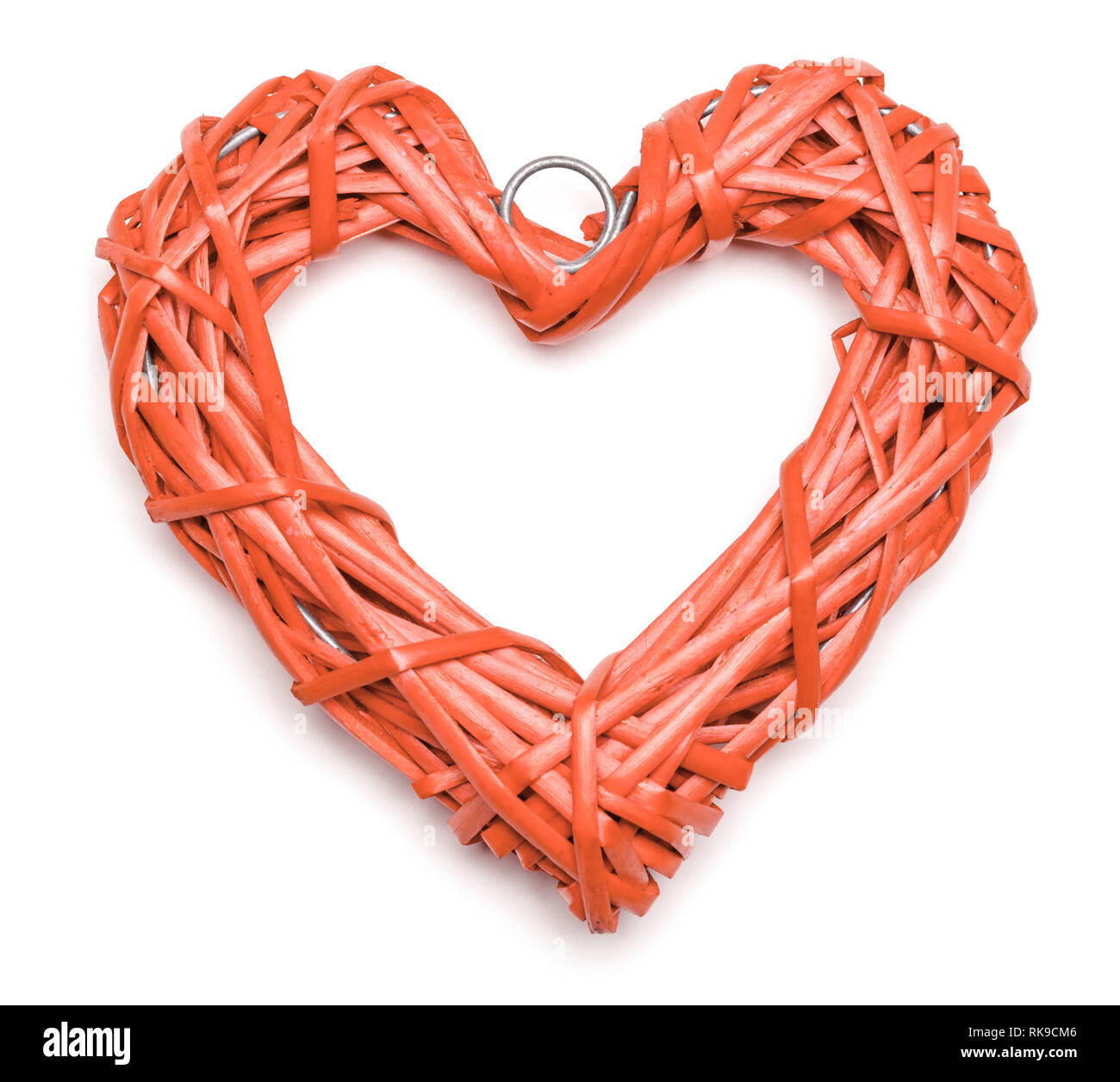 Coral color heart shaped braided wicker on white background Stock Photo