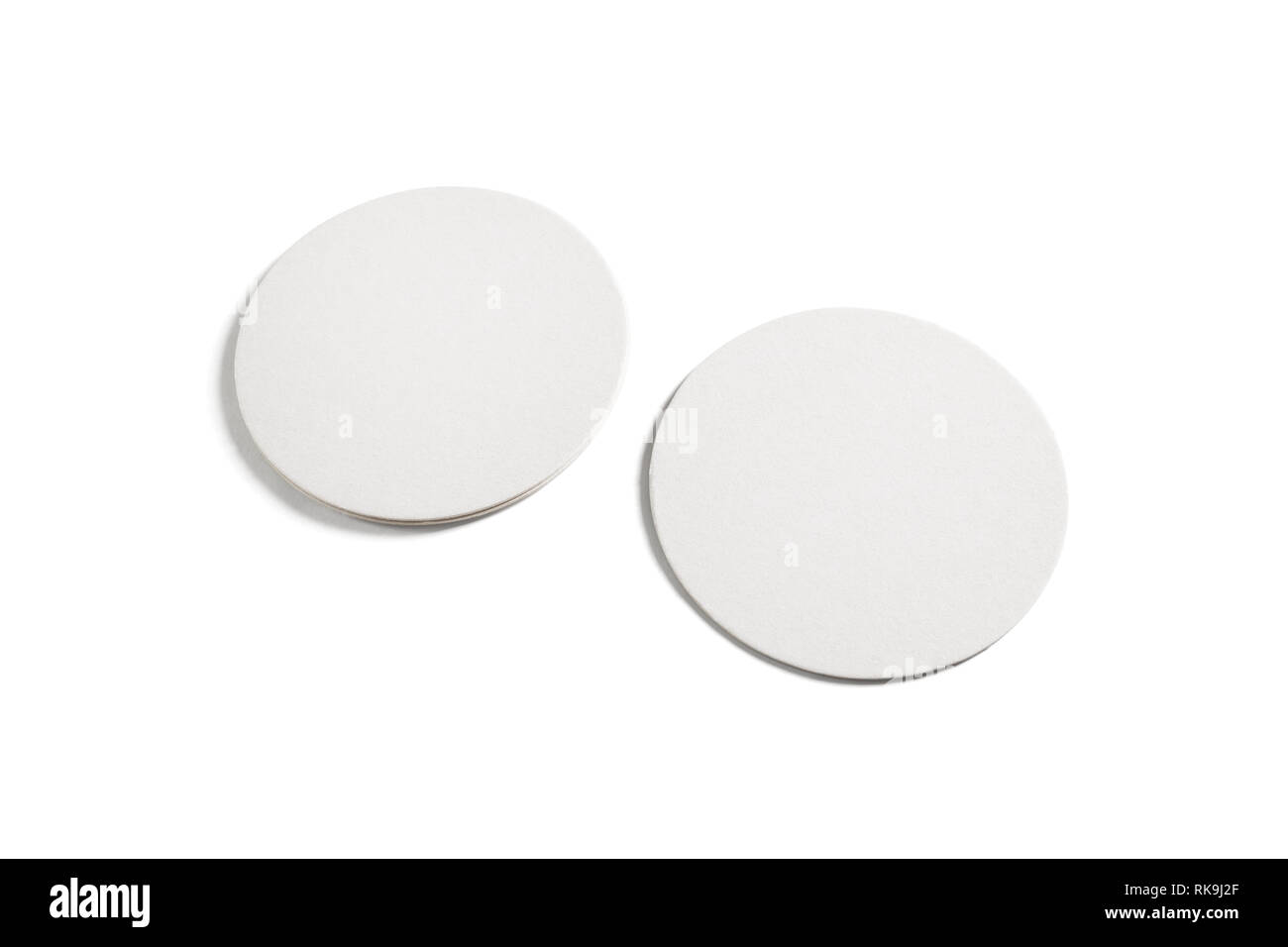 Two blank beer coasters isolated on white background. Clipping path. Stock Photo