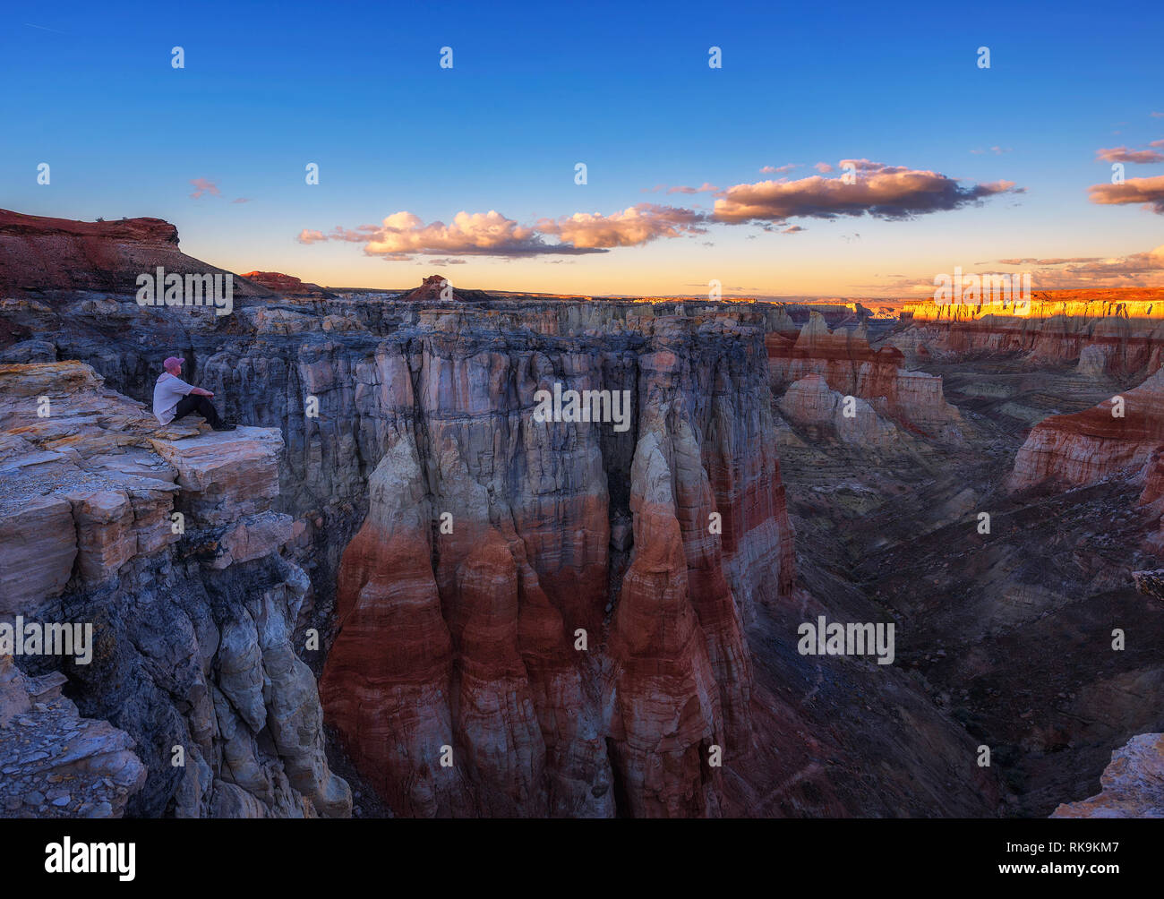 Tourist enjoys the sunset at the Coal Mine Canyon in Arizona Stock Photo
