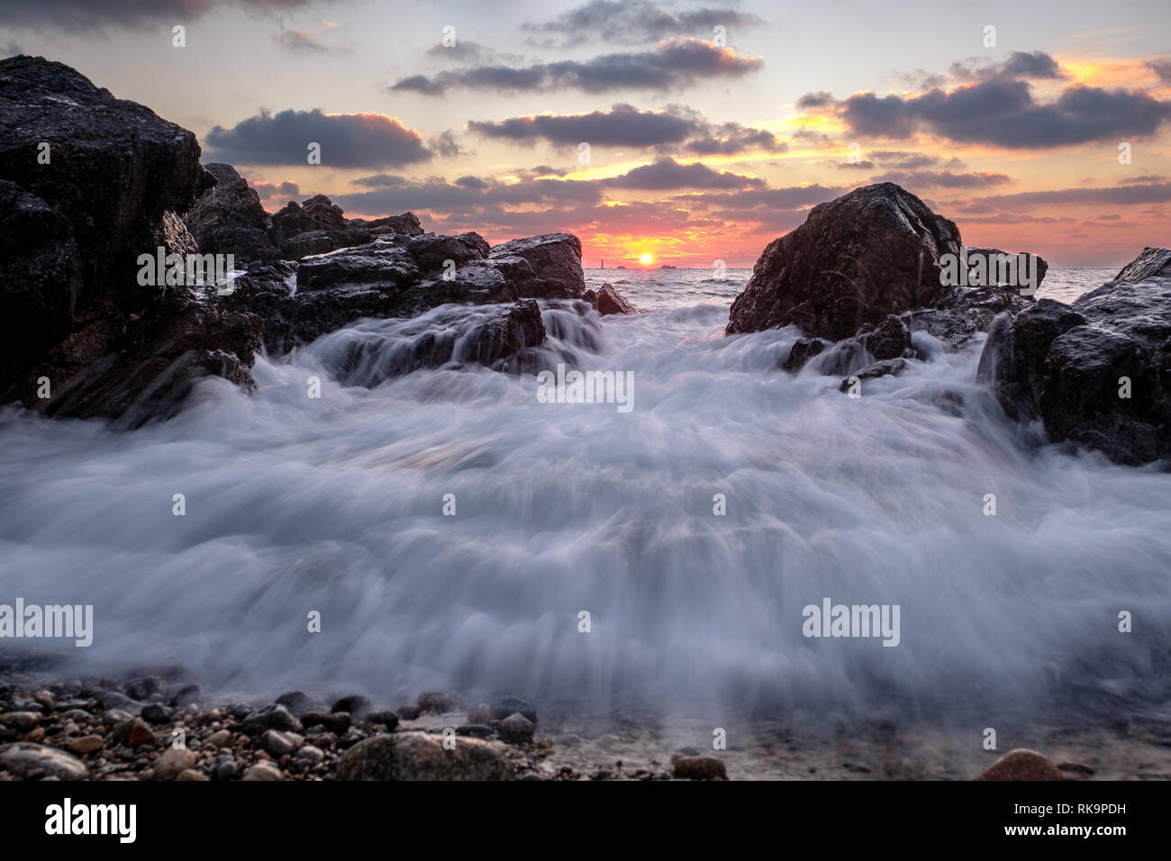 Sea motion at sunset Stock Photo