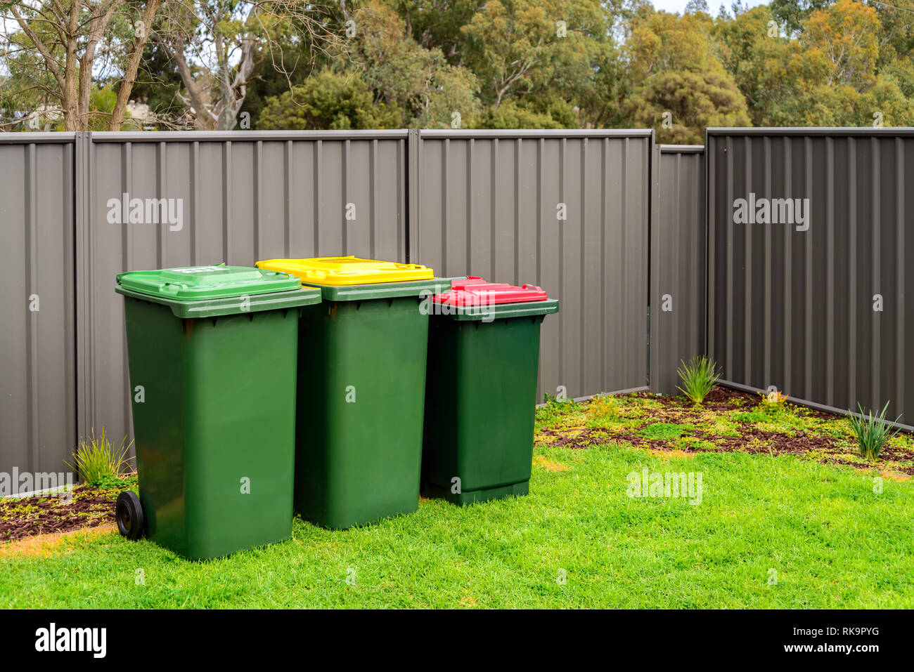 Home recyclable, green and general rubbish wheelie bins set provided by
