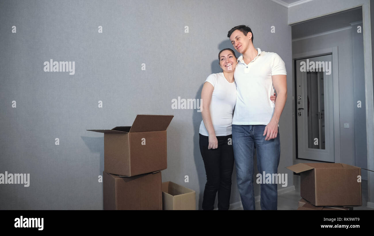 Moving to new apartment of young couple in love Stock Photo - Alamy
