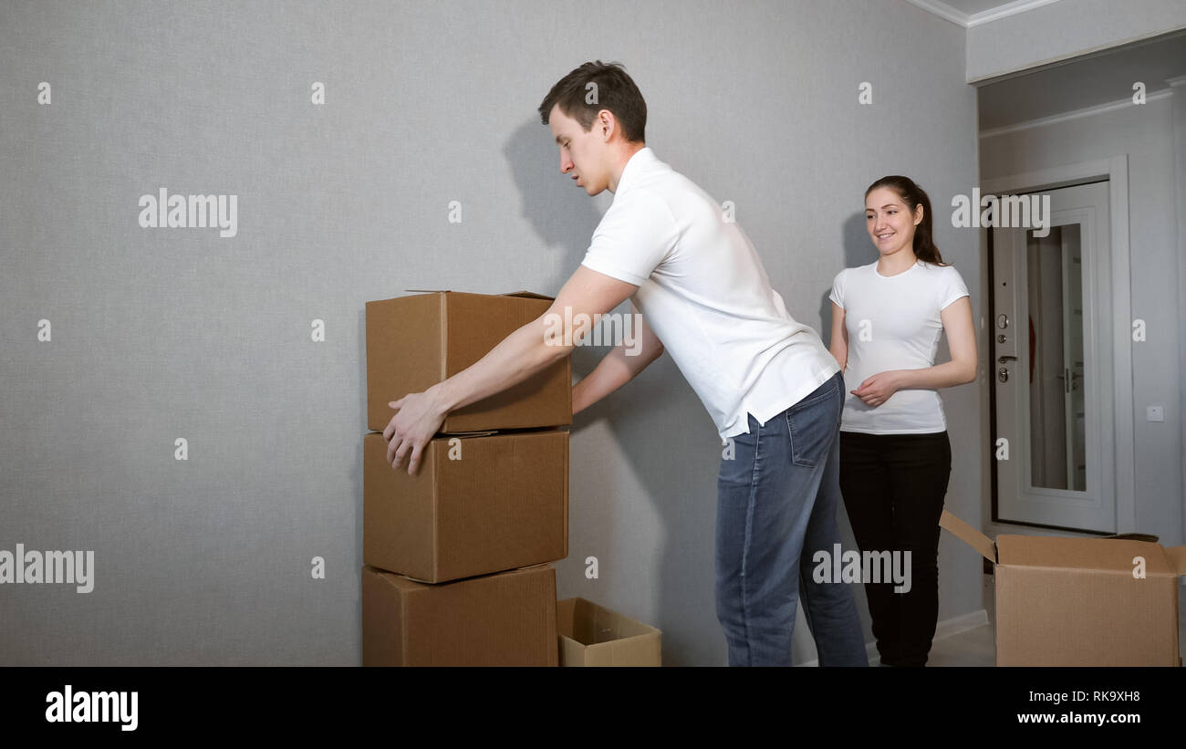 Couple Carrying Boxes Into New Home On Moving Day Stock Photo