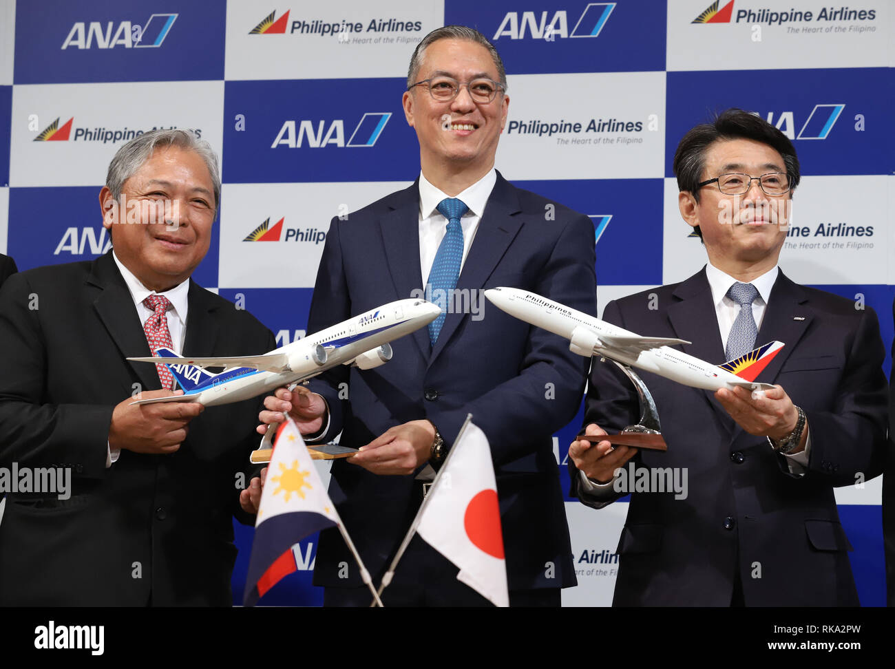 Tokyo, Japan. 8th Feb, 2019. (L-R) Philippine Airlines (PAL) president Jaime Bautista, LT Group president and PAL Holdings director Michael Tan and ANA Holdings president Shinya Katanozaka smile as they announce the companies expand their partnerships in Tokyo on Friday, February 8, 2019. ANA Holdings will invest 95 million U.S. dollars to PAL Holdings and acquire 9.5 percent of PAL Holdings shares. Credit: Yoshio Tsunoda/AFLO/Alamy Live News Stock Photo