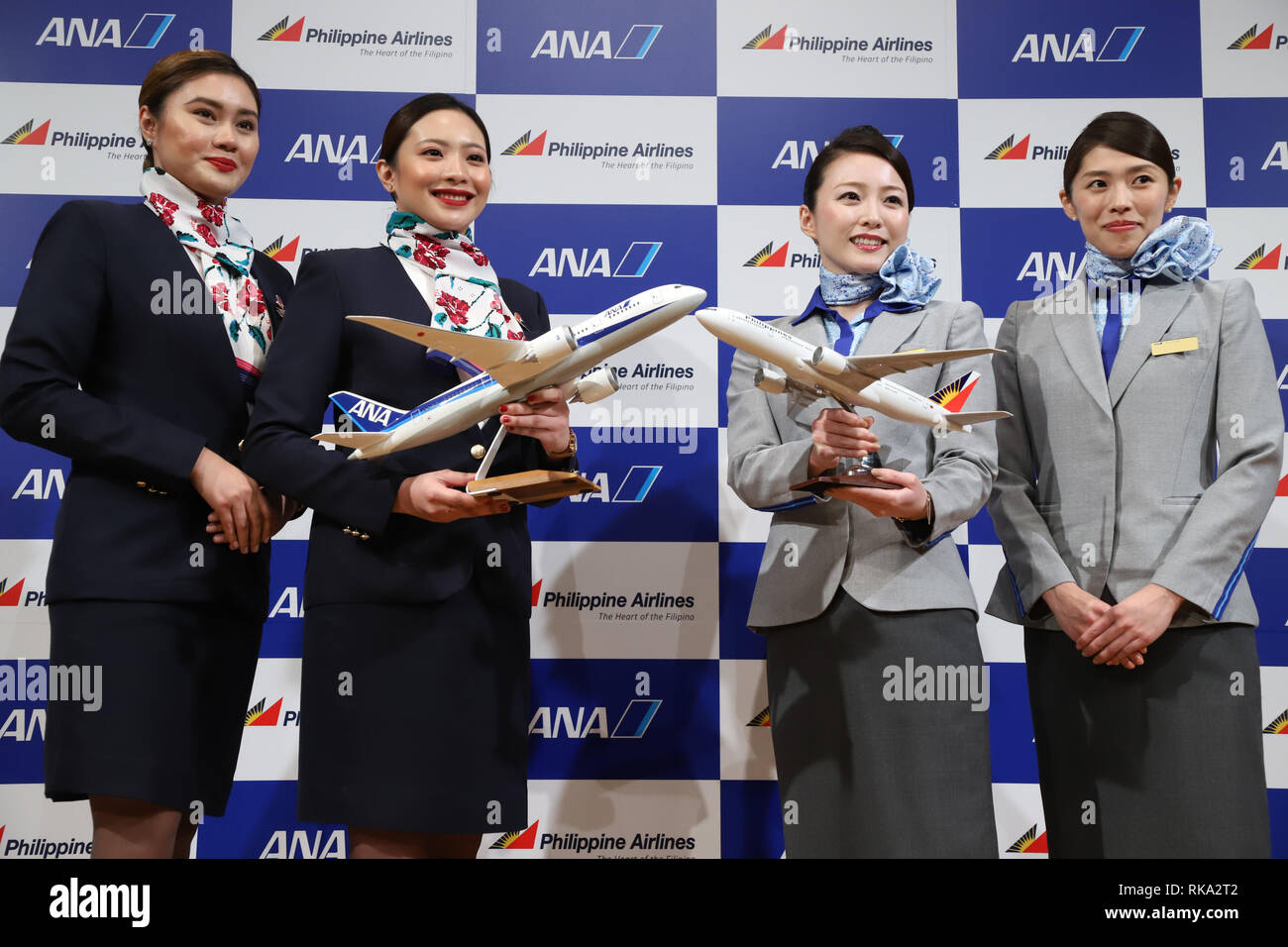 Tokyo, Japan. 8th Feb, 2019. Cabin attendants of Philippine Airlines (PAL) and All Nippon Airways (ANA) smile as they announce the companies expand their partnerships in Tokyo on Friday, February 8, 2019. ANA Holdings will invest 95 million U.S. dollars to PAL Holdings and acquire 9.5 percent of PAL Holdings shares. Credit: Yoshio Tsunoda/AFLO/Alamy Live News Stock Photo