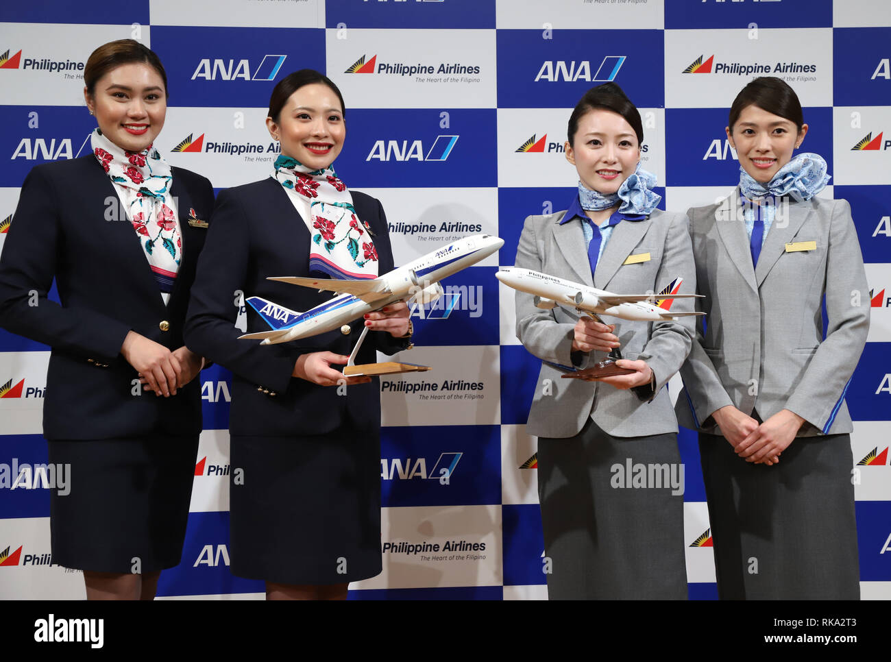 Tokyo, Japan. 8th Feb, 2019. Cabin attendants of Philippine Airlines (PAL) and All Nippon Airways (ANA) smile as they announce the companies expand their partnerships in Tokyo on Friday, February 8, 2019. ANA Holdings will invest 95 million U.S. dollars to PAL Holdings and acquire 9.5 percent of PAL Holdings shares. Credit: Yoshio Tsunoda/AFLO/Alamy Live News Stock Photo