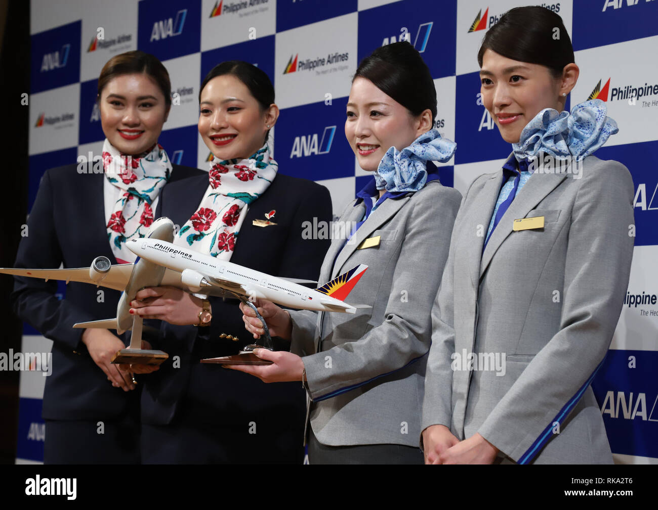 Tokyo, Japan. 8th Feb, 2019. Cabin attendants of Philippine Airlines (PAL) and All Nippon Airways (ANA) smile as they announce the companies expand their partnerships in Tokyo on Friday, February 8, 2019. ANA Holdings will invest 95 million U.S. dollars to PAL Holdings and acquire 9.5 percent of PAL Holdings shares. Credit: Yoshio Tsunoda/AFLO/Alamy Live News Stock Photo