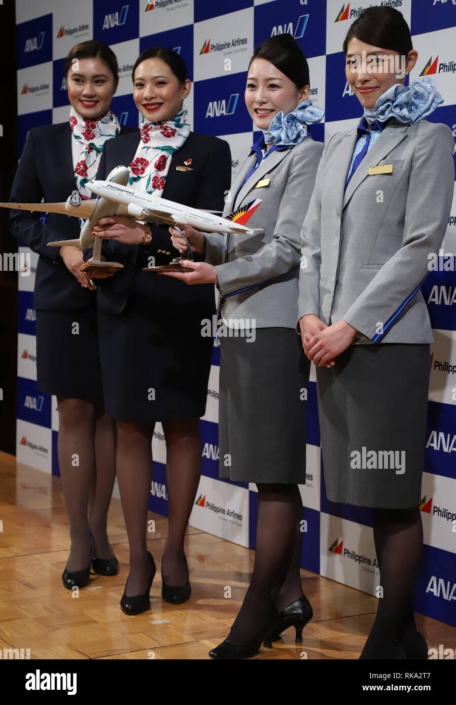 Tokyo, Japan. 8th Feb, 2019. Cabin attendants of Philippine Airlines (PAL) and All Nippon Airways (ANA) smile as they announce the companies expand their partnerships in Tokyo on Friday, February 8, 2019. ANA Holdings will invest 95 million U.S. dollars to PAL Holdings and acquire 9.5 percent of PAL Holdings shares. Credit: Yoshio Tsunoda/AFLO/Alamy Live News Stock Photo