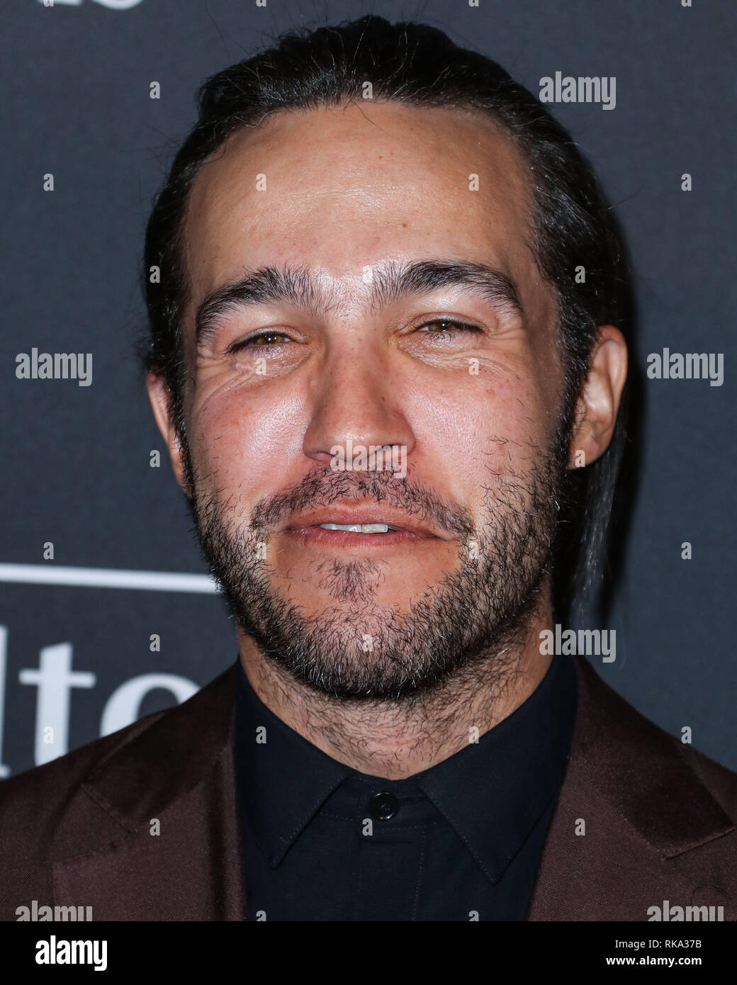 California, USA. 9th Feb 2019.  Singer Pete Wentz of Fall Out Boy wearing an Ermenegildo Zegna suit, a The Kooples shirt, and To Boot shoes arrives at The Recording Academy And Clive Davis' 2019 Pre-GRAMMY Gala held at The Beverly Hilton Hotel on February 9, 2019 in Beverly Hills, Los Angeles, California, United States. (Photo by Xavier Collin/Image Press Agency) Credit: Image Press Agency/Alamy Live News Stock Photo
