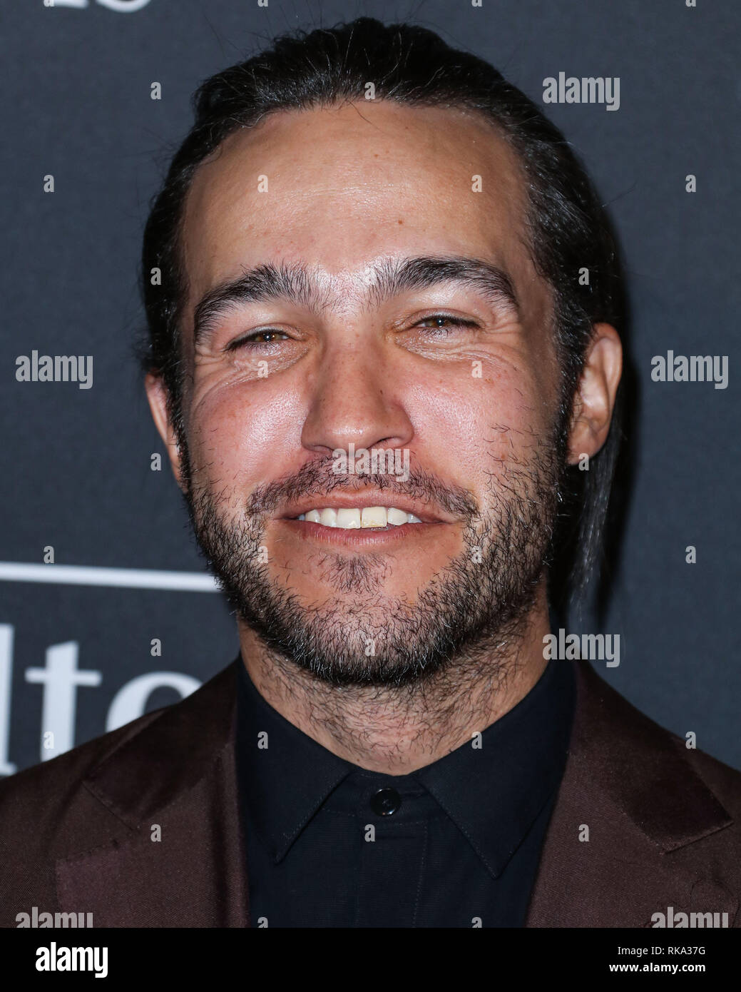 California, USA. 9th Feb 2019.  Singer Pete Wentz of Fall Out Boy wearing an Ermenegildo Zegna suit, a The Kooples shirt, and To Boot shoes arrives at The Recording Academy And Clive Davis' 2019 Pre-GRAMMY Gala held at The Beverly Hilton Hotel on February 9, 2019 in Beverly Hills, Los Angeles, California, United States. (Photo by Xavier Collin/Image Press Agency) Credit: Image Press Agency/Alamy Live News Stock Photo