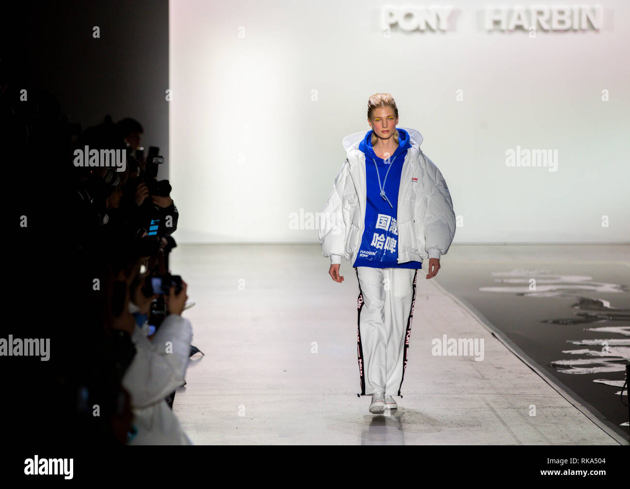 New York, USA. 9th Feb, 2019. A model presents creations at the "PONY X HARBIN" show during the New York Fashion Week in New York, the United States, Feb. 9, 2019. Popular Chinese brand Harbin Beer on Saturday put on an experimental show that blended traditional Chinese culture and American street art at the ongoing New York fashion week. The show started with a short music piece that was a fusion of Peking Opera and R&B, followed by a catwalk show debuting collection jointly presented by Harbin Beer and American sports brand PONY. Credit: Wang Ying/Xinhua/Alamy Live News Stock Photo