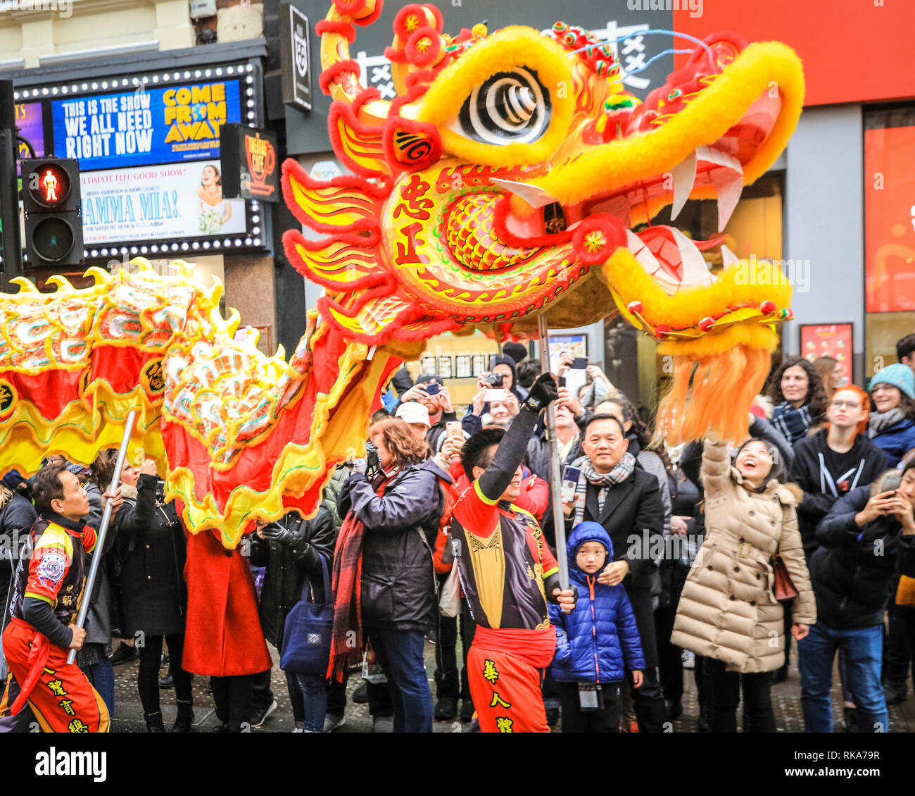 London, UK 10th Feb 2019. The dragon at the front of the procession. The performers make their way through Soho. London's Chinese New Year celebrations, the largest outside Asia, take place with colourful parades, lion and dragon dances, a procession through Soho, cultural performances and displays in and around Chinatown, the West End and Trafalgar Square. 2019 welcomes the Year of the Pig. Credit: Imageplotter News and Sports/Alamy Live News Stock Photo