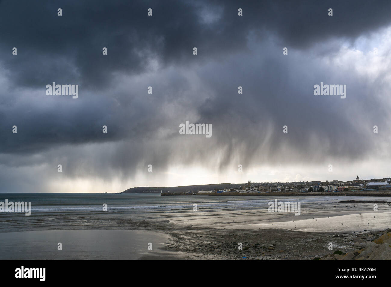 Penzance, Cornwall, UK. 10th Feb 2019. UK Weather. Fast moving clouds bringing wintry showers over the far south west of Cornwall this lunchtime. Credit: Simon Maycock/Alamy Live News Stock Photo