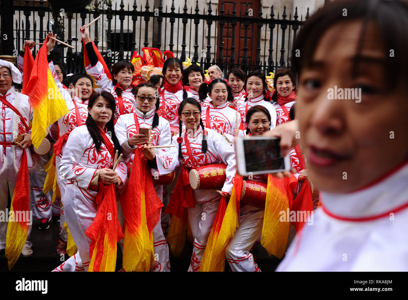London, UK. 10th Feb, 2019. Dancers seen posing for a photo on Duncannon Street in central London during the annual Chinese New Year Parade.Chinese New Year itself and the start of the Year of the Pig fell on February 5, with London's Overseas Chinese community holding their main celebrations, including the annual parade on the 10th February. Credit: David Cliff/SOPA Images/ZUMA Wire/Alamy Live News Stock Photo