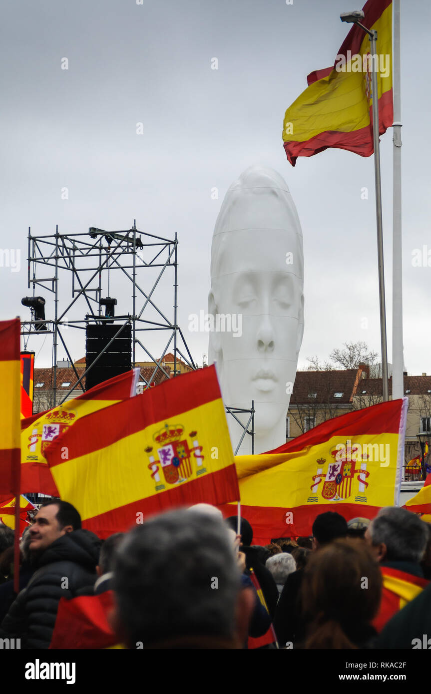 Madrid, Spain. 10th Feb 2019. Thousands of people have demonstrated in Madrid against the politics of the nation president Pedro Sanchez. The demonstration was convened by the main opposition parties. In the picture the protesters along with the sculpture called Julia, the work of the Jaume Plensa sculptor.  Credit: F. J. Carneros/Alamy Live News Stock Photo