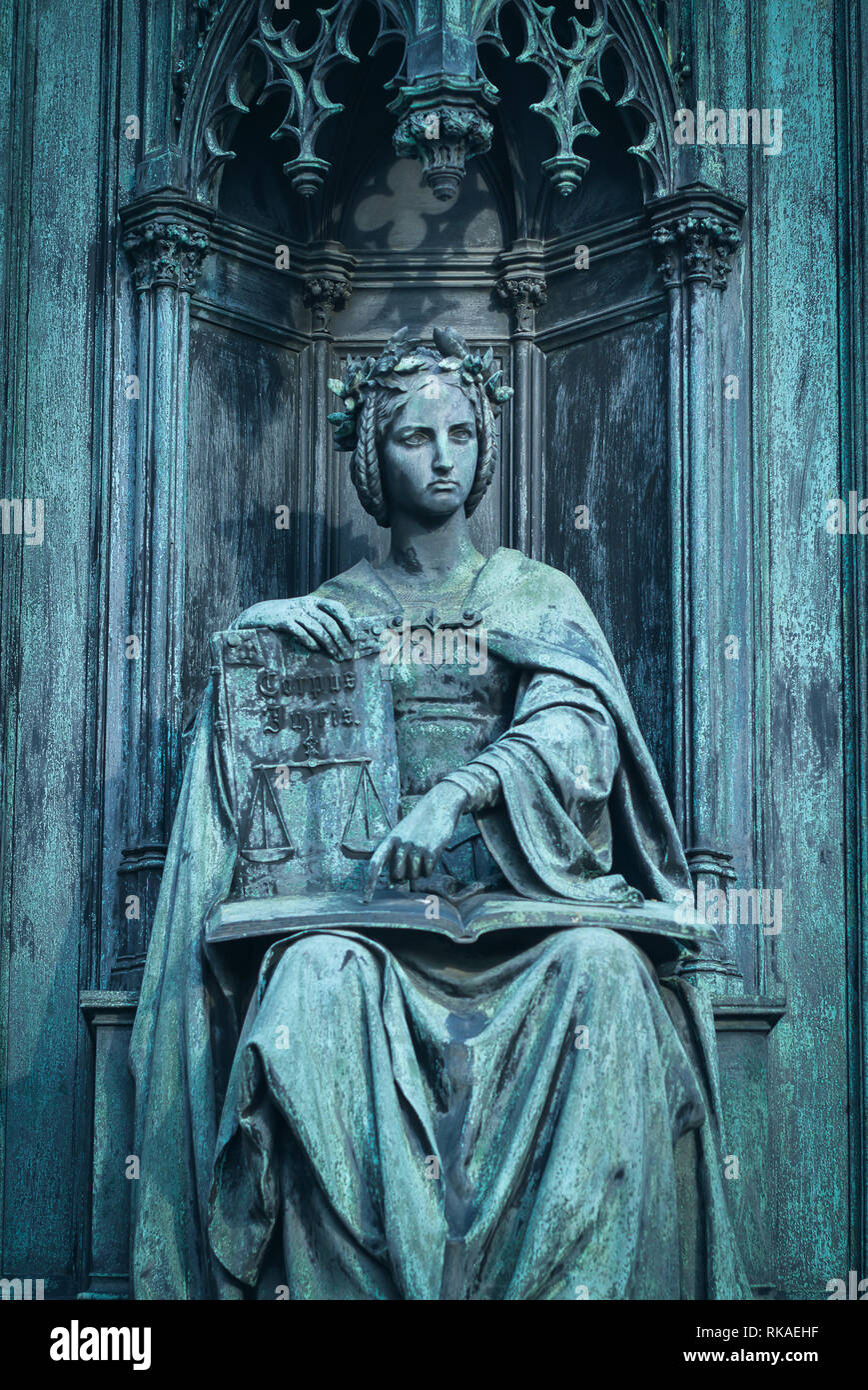 neo-gothic statue of woman holding book Stock Photo