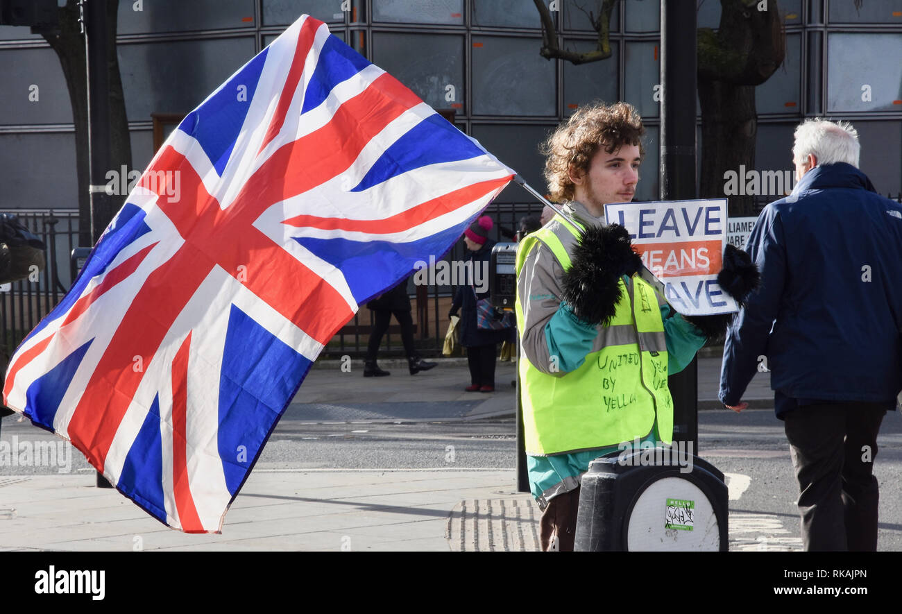 Young Brexiteer wearing a yellow vest campaigning for Brexit,Parliament Square,Westminster,London.UK Stock Photo