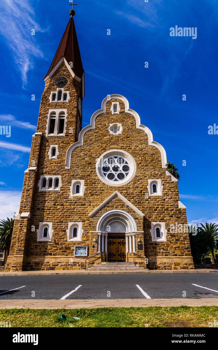 The classic German Lutheran Church of Christ in Windhoek in the setting of palm trees. One of the main attractions of the city. Stock Photo