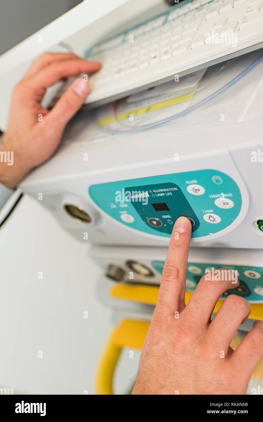 Doctor working with endoscope equipment in the medical clinic Stock