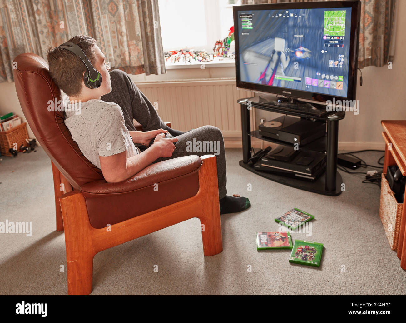 A boy plays Fortnite Battle Royale on his Xbox one Stock Photo - Alamy
