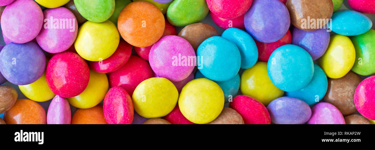 Colorful round candies panoramic background Stock Photo