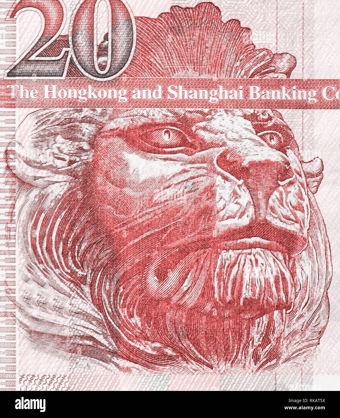 British lion on the fragment of old twenty Hong Kong Dollars banknote close-up. Living coral color toned image Stock Photo