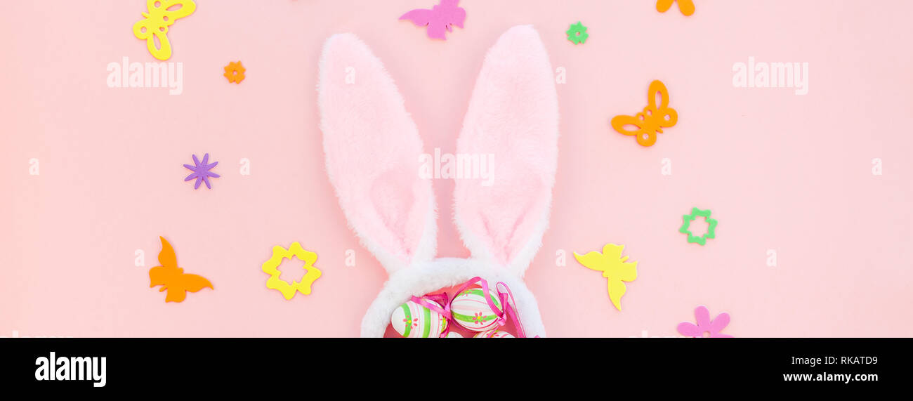 Creative Top view flat lay holiday composition Easter eggs bunny ears ...