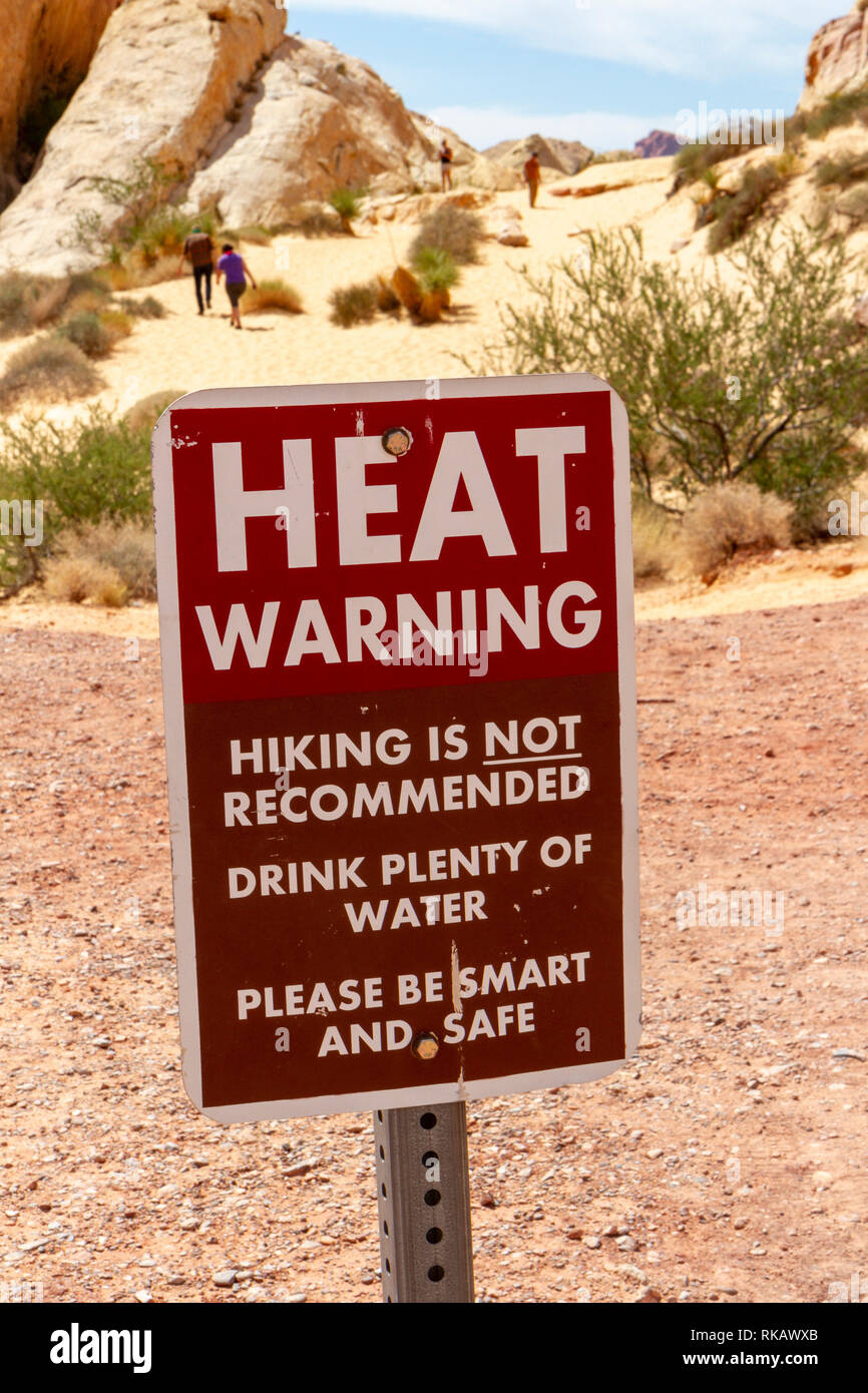 A common 'Heat Warning' sign in the White Domes area of Valley of Fire State Park, Overton, Nevada, United States. Stock Photo