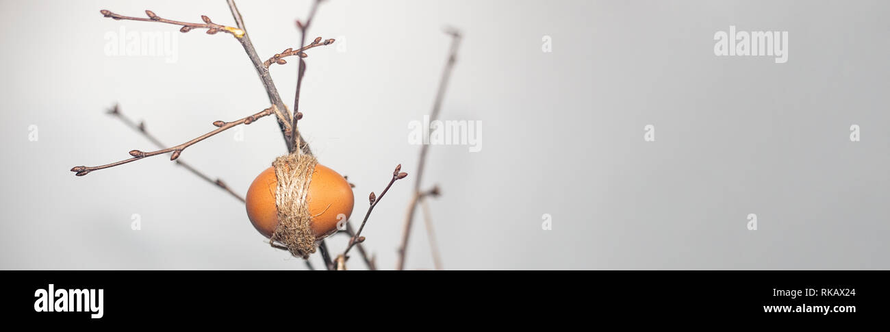 Easter concept. Spring time. Eggs hanging on branches Stock Photo