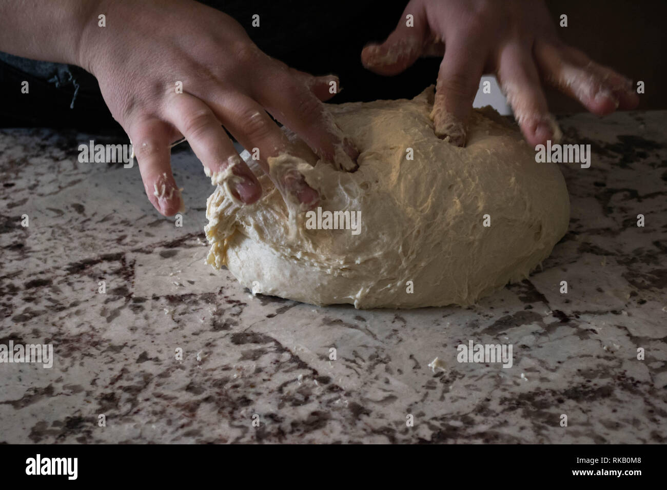 Baker kneading sourdough bread dough before allowing it to rise further Stock Photo Alamy