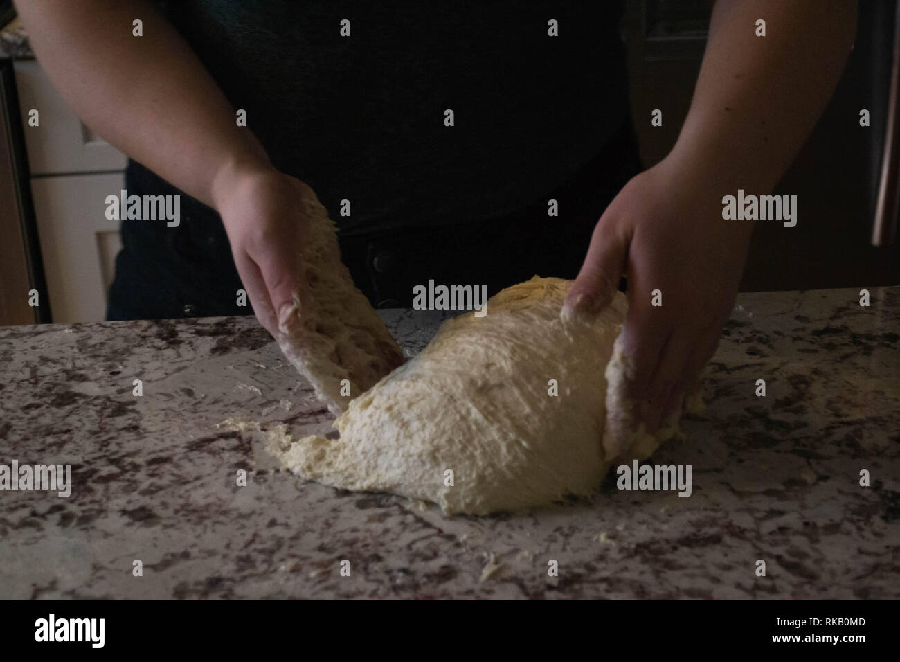 Baker kneading sourdough bread dough before allowing it to rise further Stock Photo Alamy