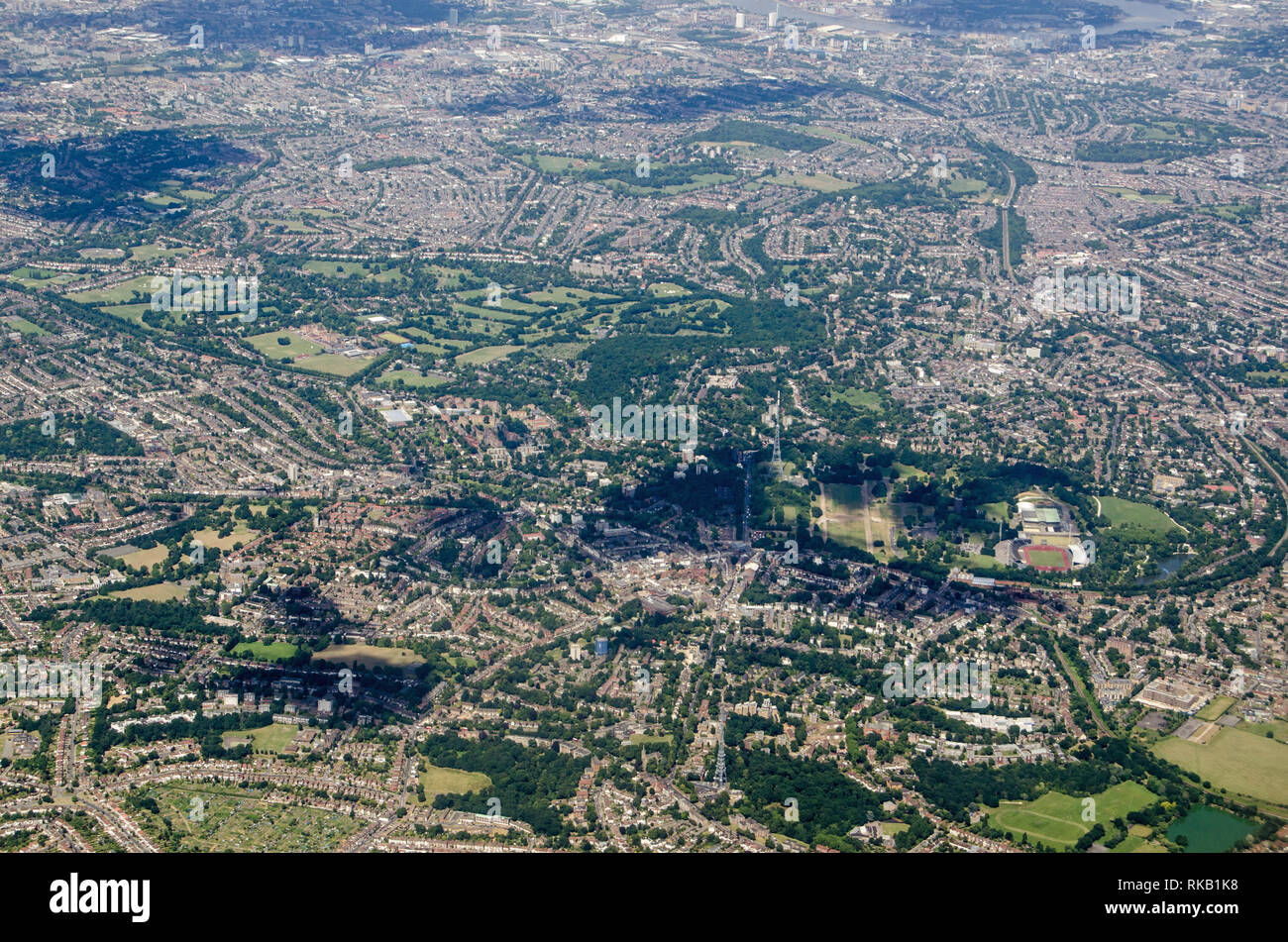 Aerial view across South London with the television transmitters and National Sports Centre of Crystal Palace at the bottom of the image and the wareh Stock Photo