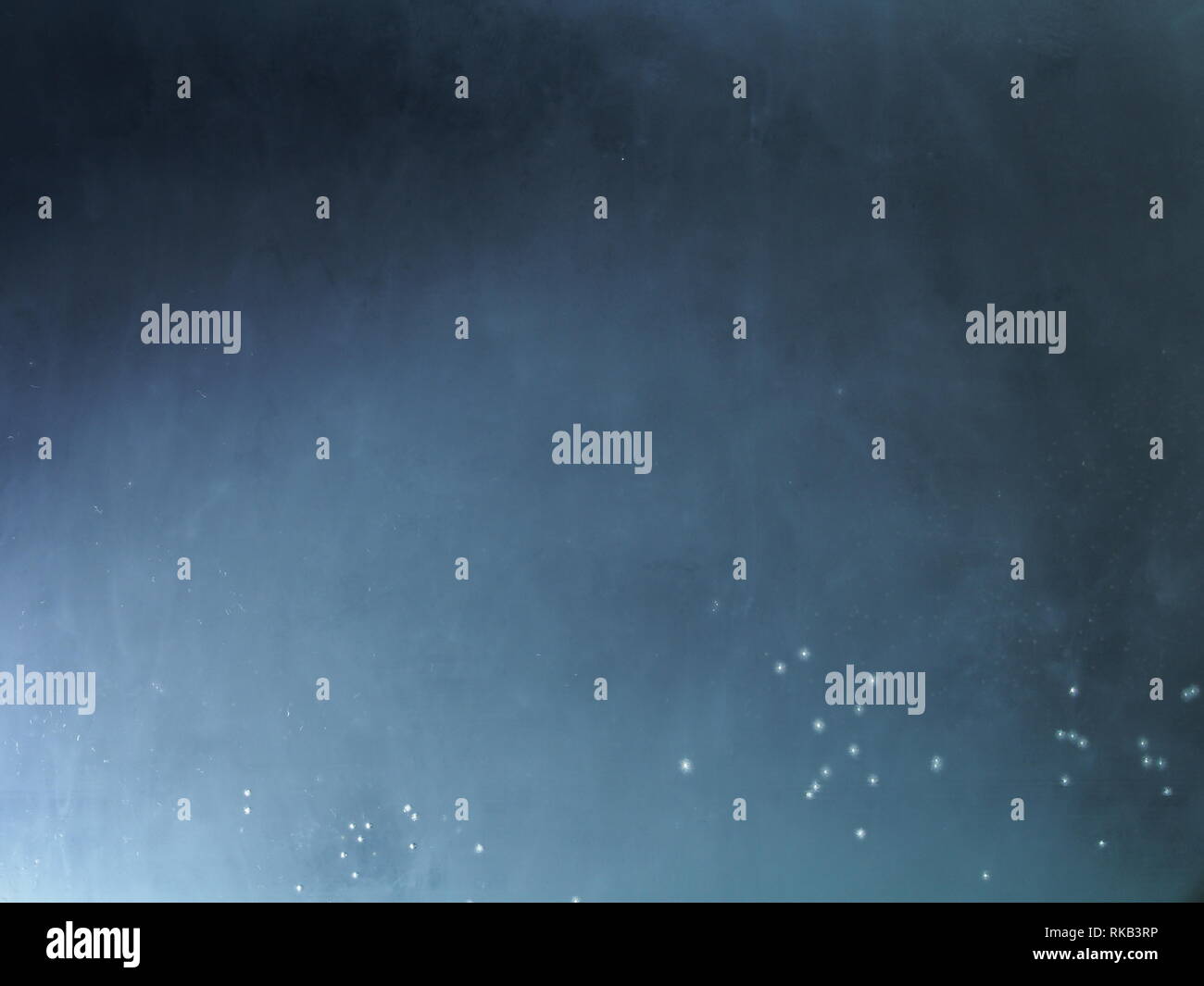 A drop of paint dissolves in water. On black background. Abstract ...