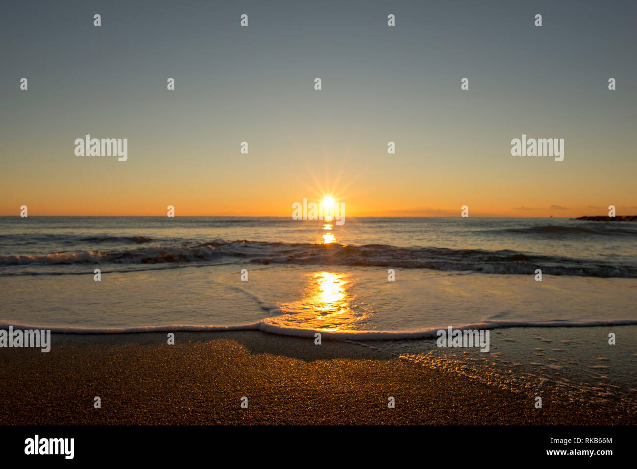 Sunrise on a beach in Denia, Alicante, Spain Stock Photo - Alamy