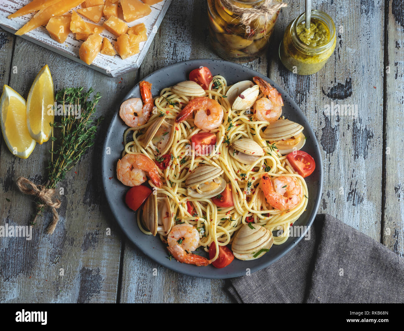 Cooked pasta with seafood clams, shrimps tomato on a plate , spaghetti Stock Photo