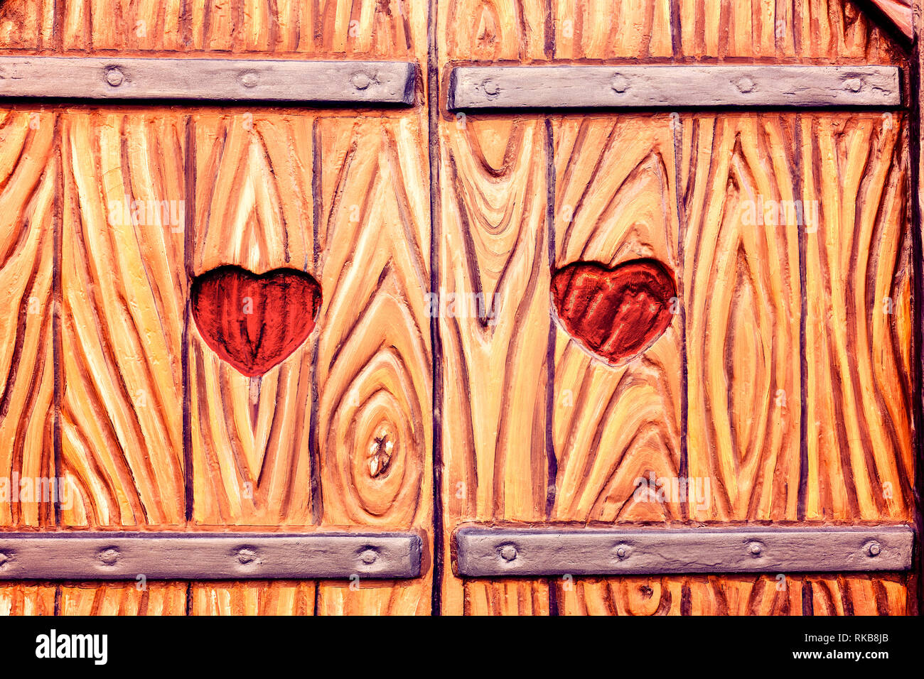 tow  heart carved in wood on wooden window.Valentines day. Stock Photo