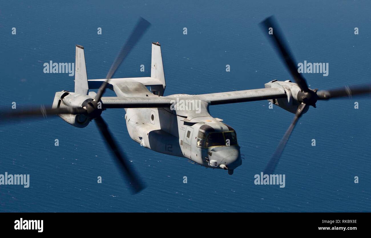 An MV-22 Osprey with the 22nd Marine Expeditionary Unit transports personnel, mail and cargo over the Arabian Sea in route to the Wasp-class amphibious assault ship USS Kearsarge (LHD-3). The Osprey, attached to Marine Medium Tiltrotor Squadron 264 (Reinforced), departed to the Kersarge from Qatar. Marines and Sailors with the 22nd MEU and Kearsarge Amphibious Ready Group are deployed to the 5th Fleet area of operations in support of naval operations to ensure maritime stability and security in the Central Region, connecting the Mediterranean and the Pacific through the western Indian Ocean an Stock Photo