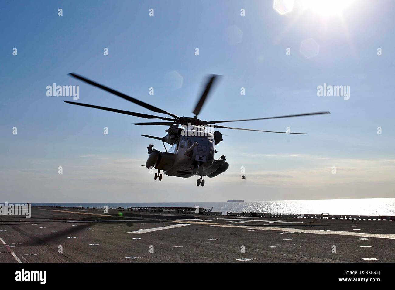 190205-M-QP631-1008 ARABIAN SEA (Feb. 1, 2019) A CH-53E Super Stallion with the 22nd Marine Expeditionary Unit prepares to land on the flight deck of the Wasp-class amphibious assault ship USS Kearsarge (LHD-3). The Super Stallion, attached to Marine Medium Tiltrotor Squadron 264 (Reinforced), was peforming routine flight operations. Marines and Sailors with the 22nd MEU and Kearsarge Amphibious Ready Group are deployed to the 5th Fleet area of operations in support of naval operations to ensure maritime stability and security in the Central Region, connecting the Mediterranean and the Pacific Stock Photo