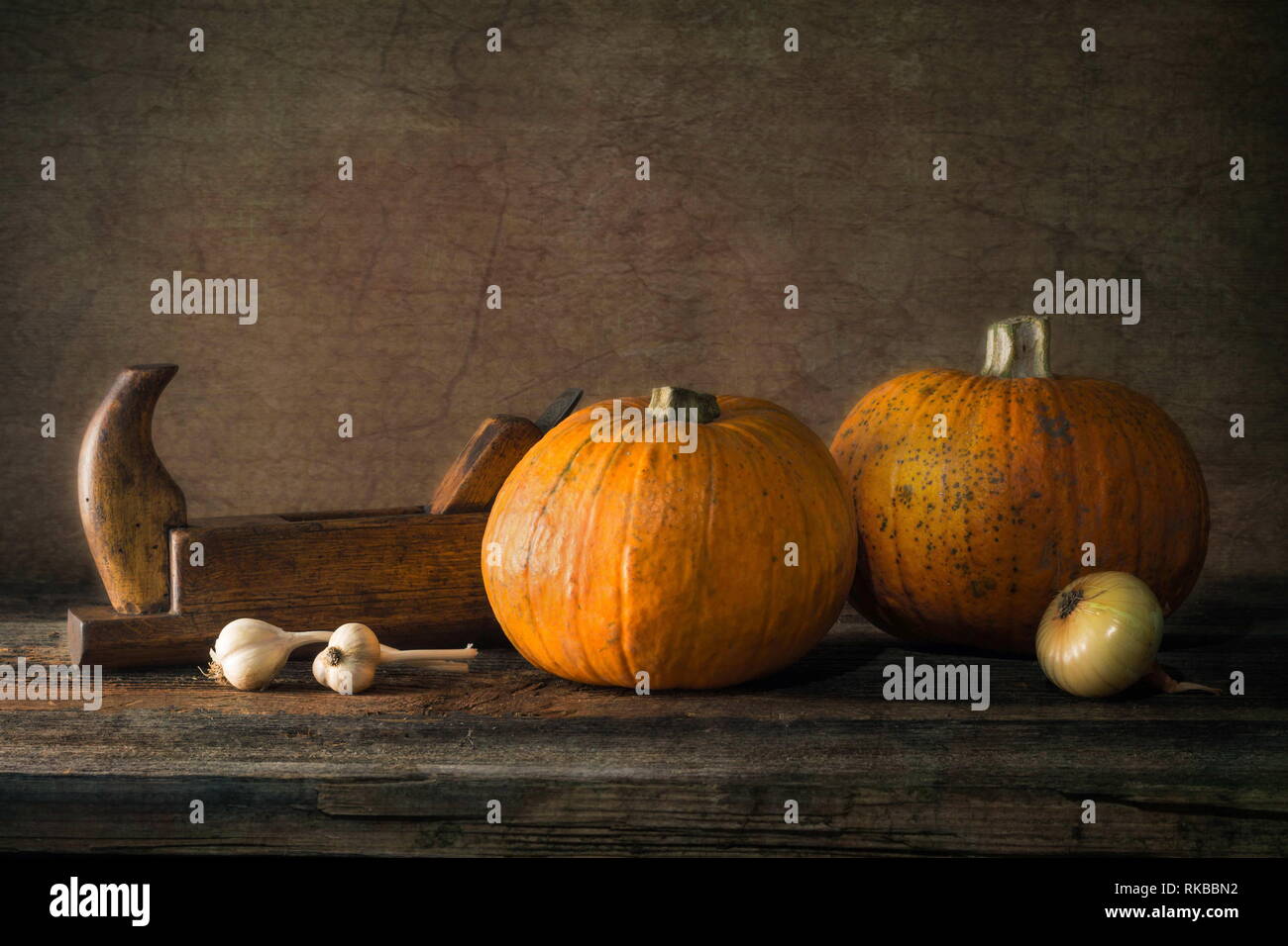 Nature morte with pumpkin, onion, garlic and plane Stock Photo