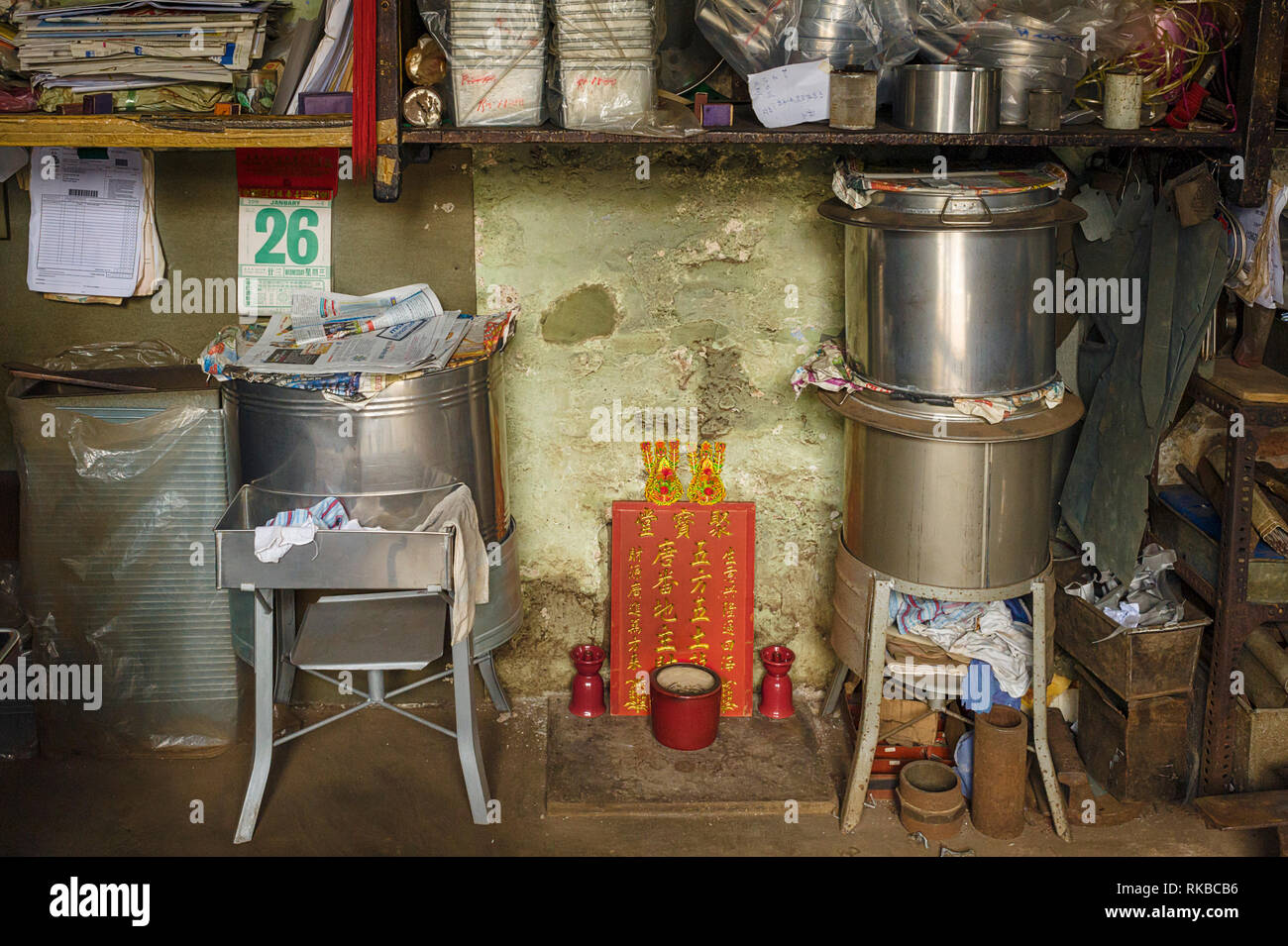 Tin Smith fabricating metal wares, such as pots, pans, in old town of Ipoh, Perak, Malaysia Stock Photo