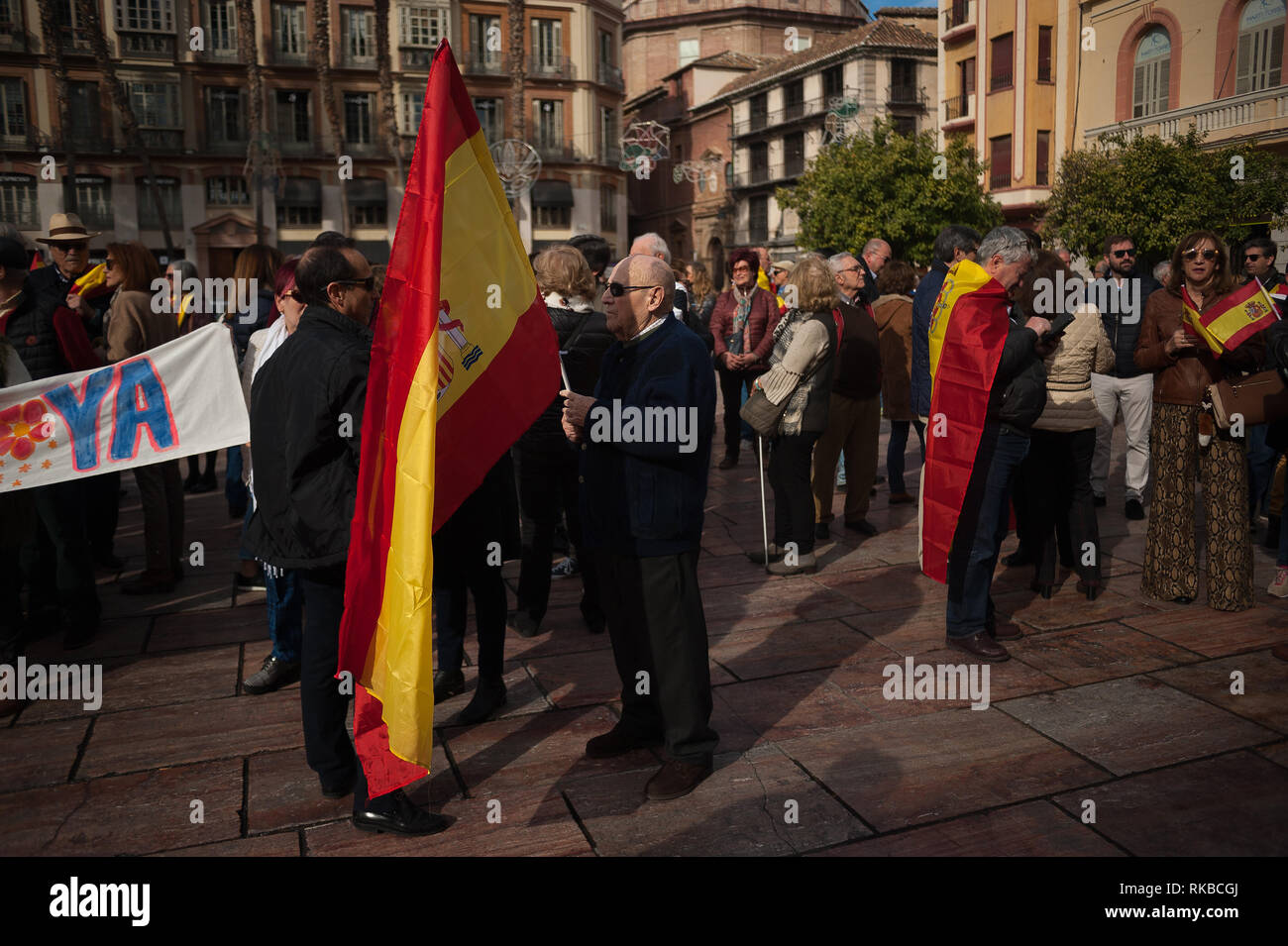 A supporter of the unite between Spain and Catalonia called by right parties, seen holding a Spanish flag as he takes part in a demonstration against the Spanish government of Pedro Sánchez. Stock Photo